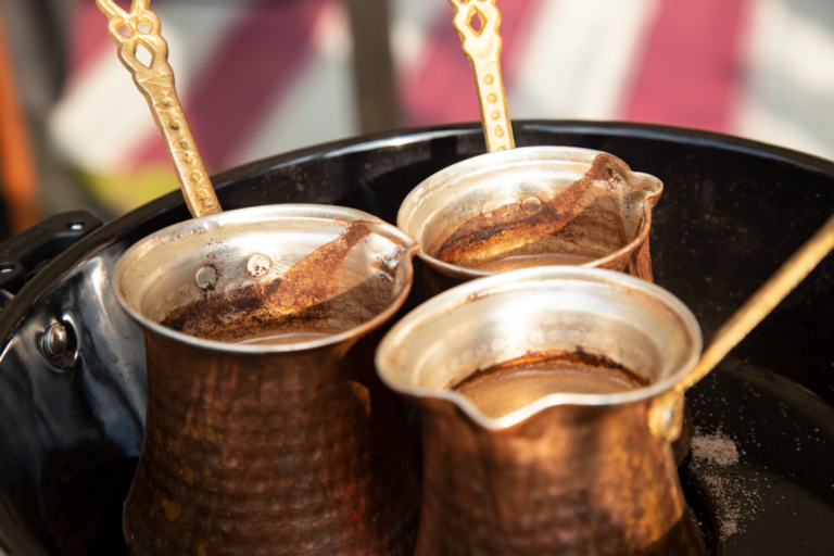 Three pots of coffee produced in a medieval style